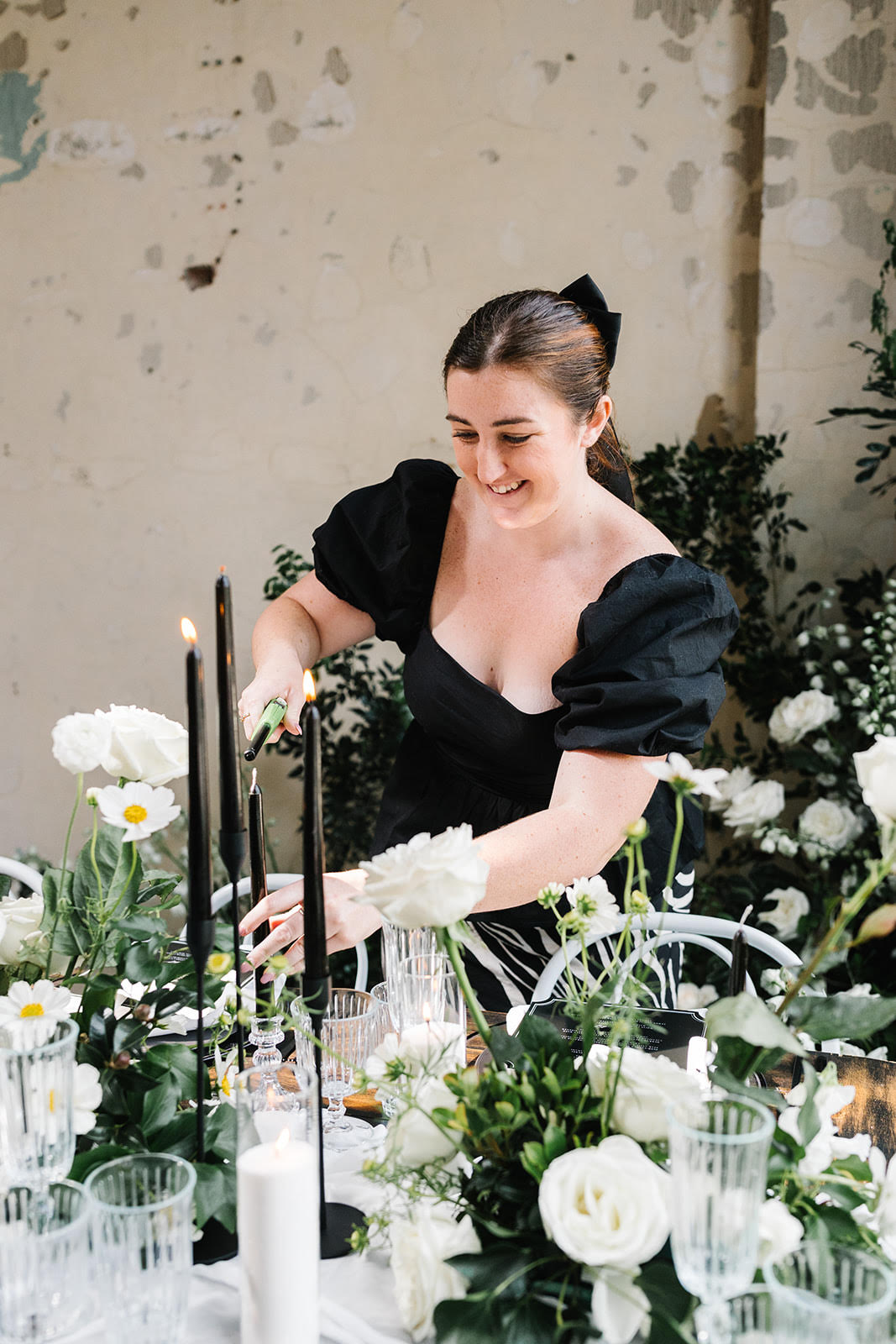 Bethany Cook lighting candles at Brisbane wedding
